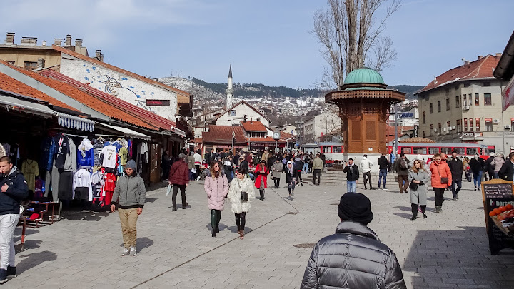 Many people walk through Sarajevo