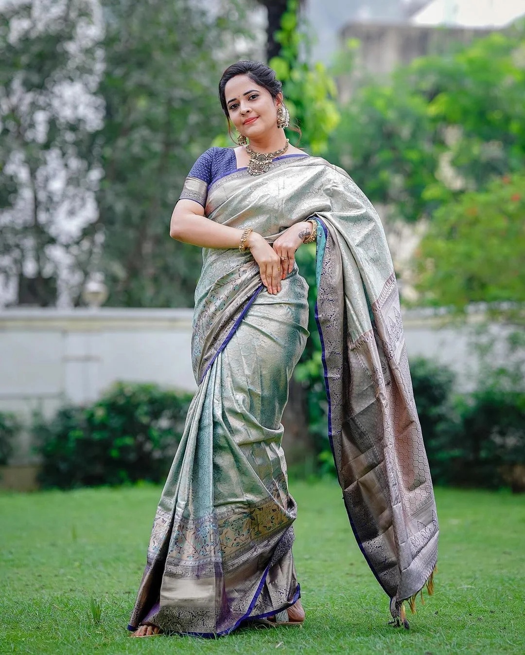 Anasuya bharadwaj looks in silver traditional saree photoshoot