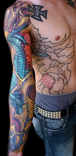 bio mechanical tattoos on arm