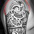 Extension shoulder tattoo in Polynesian mixed style