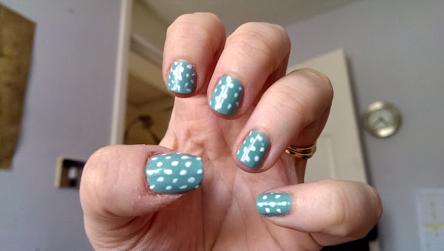 Teal and white polka dot manicure