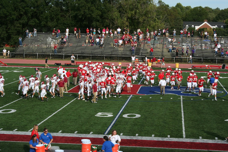 Rose Hulman and Hanover College players congratulate each other after the 