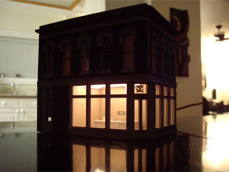Completed DPM The Other Corner Café kit modeled as a bank showing interior lighting effects