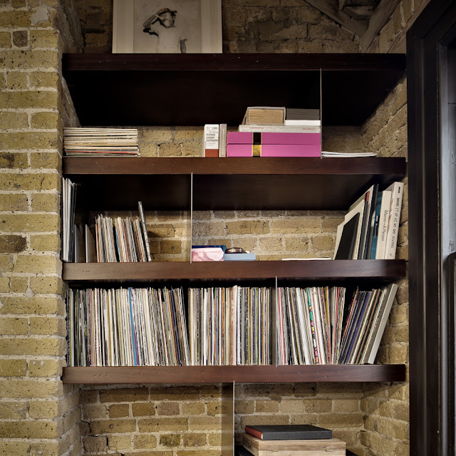 Picture of the book shelves in the brick wall