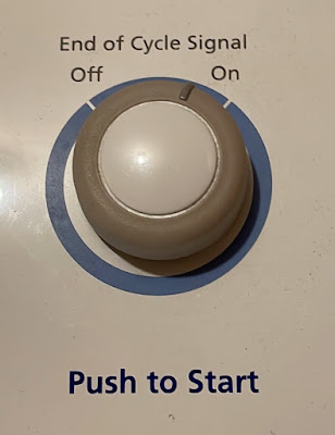 Dryer buttom with ““Push to start” in large bold letters.