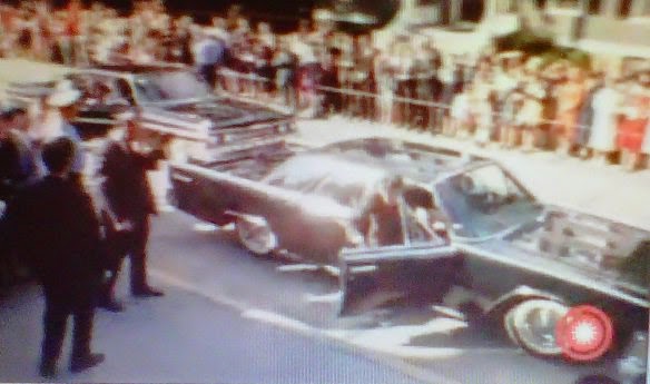 JFK in the bubbletop limo, heading to church