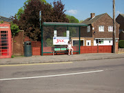 Candy's sister waiting for a bus.She sat here with the JACK sign for 45 . (bus stop in puckeridge stansted run )