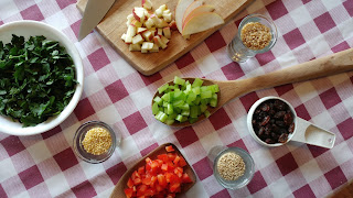 ingredients for the salad on a cutting board or displayed in bowls 