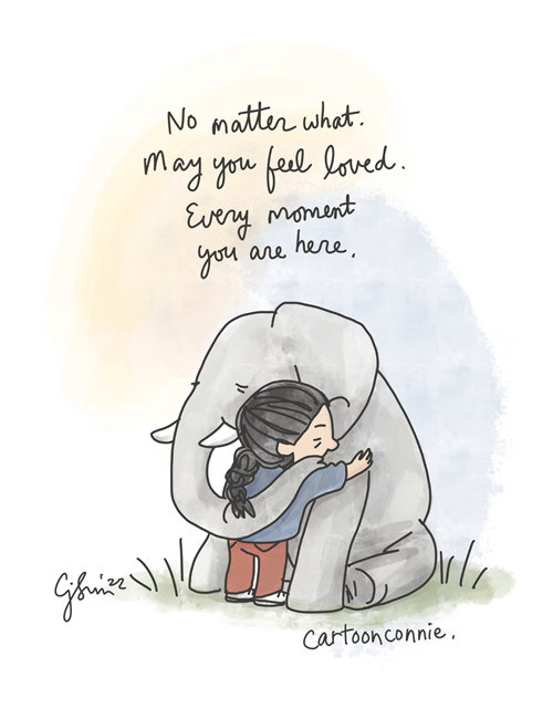 Single-panel cartoon illustration of a girl with a braid hugging a seated baby elephant. Handwritten caption reads, "No matter what. May you feel loved. Every moment you are here." Image references recent tragedies and a wish for comfort in turbulent times. Original drawing by Connie Sun, cartoonconnie, 2022.