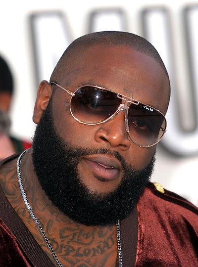 rick ross tattoos on his hand. his career, Rick Ross is