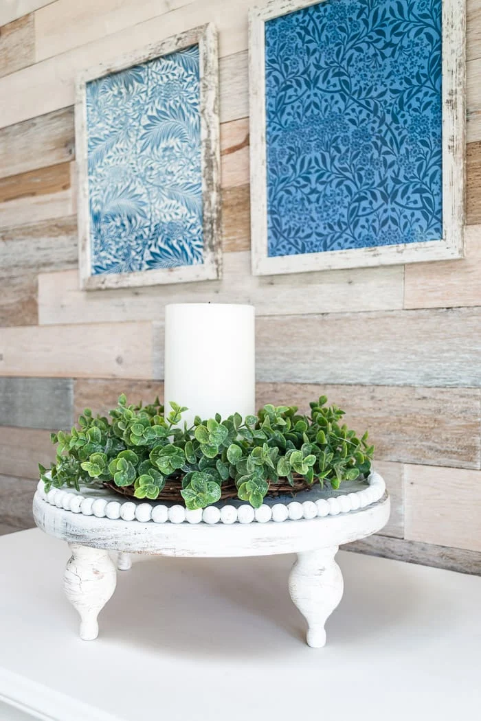 white chippy beaded wood riser, wood walls, vintage blue and white art