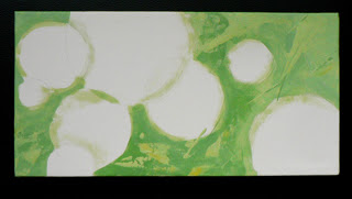 White circles, green background