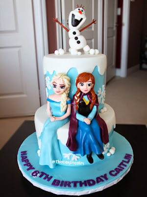 beautiful frozen elsa anna olaf figurines on cake