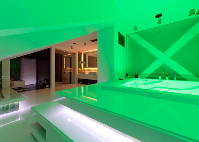 Picture of the modern bathroom with green lighting 