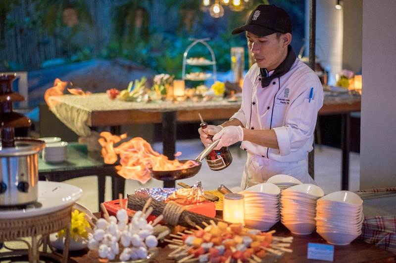 A Banyan Tree chef prepares a flaming flambé at Sands relaunch night, 19 December 2019.