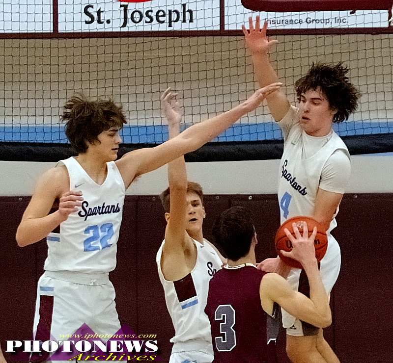 Ty Pence, Garrett Seims, and Coy Taylor try to block a shot