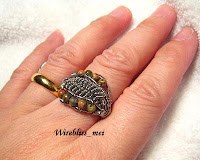 wire wrapped ethnic ring around finger