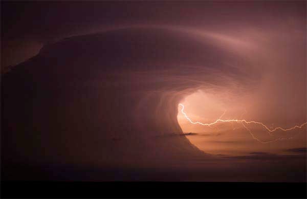 11.) Sometimes, cloud and storm formations can leave you in terrible awe. This photo is of a super cell that formed over southern Nebraska in June 2011. It looks like a tsunami forming in the sky. - 12 of the Strangest Weather-Related Photographs Ever Taken