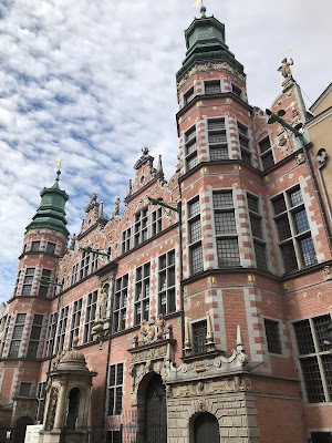 intricate building under a cloudy blue sky