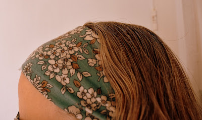 wide turquoise floral headband on model