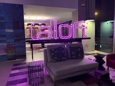 Lobby area with a neon sign