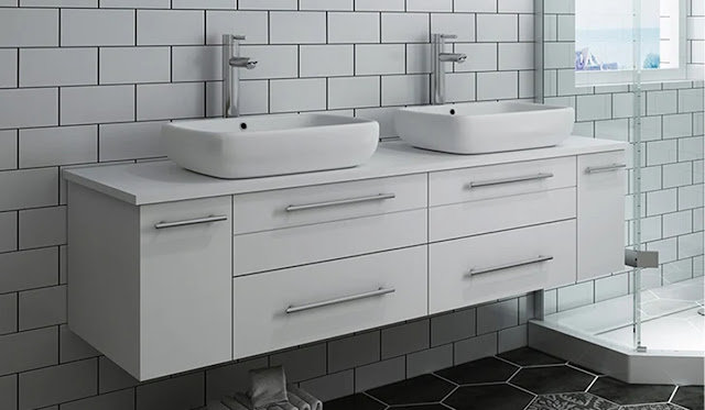White double vanity in a white bathroom with subway tile.