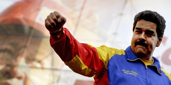 Foto: Venezuelan President Nicolas Maduro raises his fist during a May Day rally in Caracas on May 1, 2014. AFP PHOTO/FEDERICO PARRA        (Photo credit should read FEDERICO PARRA/AFP/Getty Images)