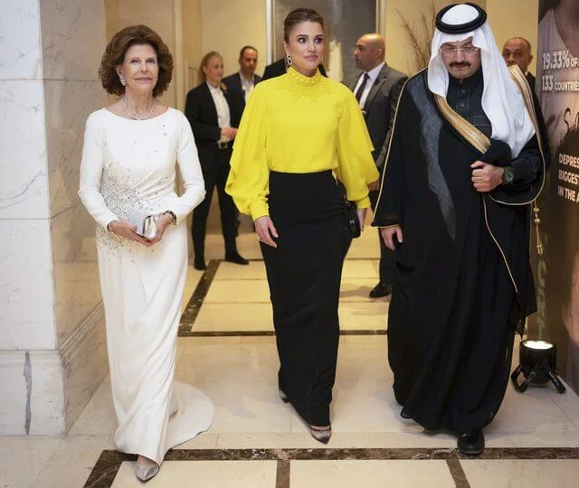 Queen Rania wore a Crista camel stripes dress by Silvia Tcherassi. Andrew GN yellow beaded jewel-collar draped slit-sleeve top blouse