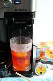 Make a refreshing, fruity flavored iced tea in minutes with this Peach Mango Iced Tea for One. #TeaMoments #ad