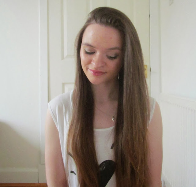 girl with long brown hair swept to right