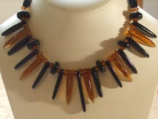 Amber and black plastic necklace