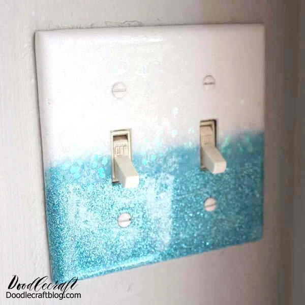How to make a glittery light switch plate cover using glitter and resin!  Customize the color of glitter and top it off with High Gloss Resin for a smooth and shiny finish.  It’s a simple DIY craft that just takes a few minutes of work time and overnight drying.