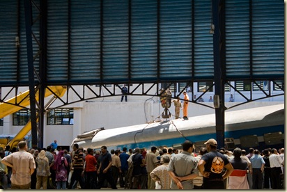 Repair crews from Egyptian Railways lifting derailed train cars