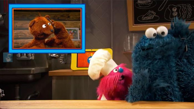 Sesame Street Episode 4804. Cookie Monster's Foodie Truck. A girl orders porridge from Cookie Monster and Gonger.
