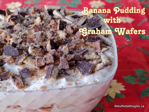 Banana Pudding made with graham crackers and topped with chopped chocolate covered graham wafers and Skor bar.