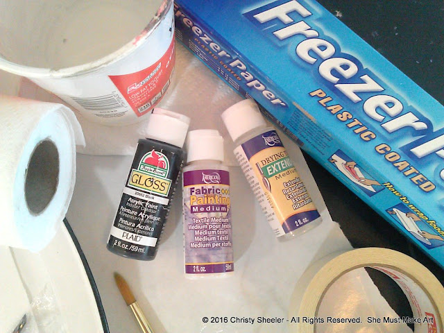 The main supplies needed for the black lettering on the fabric banner.