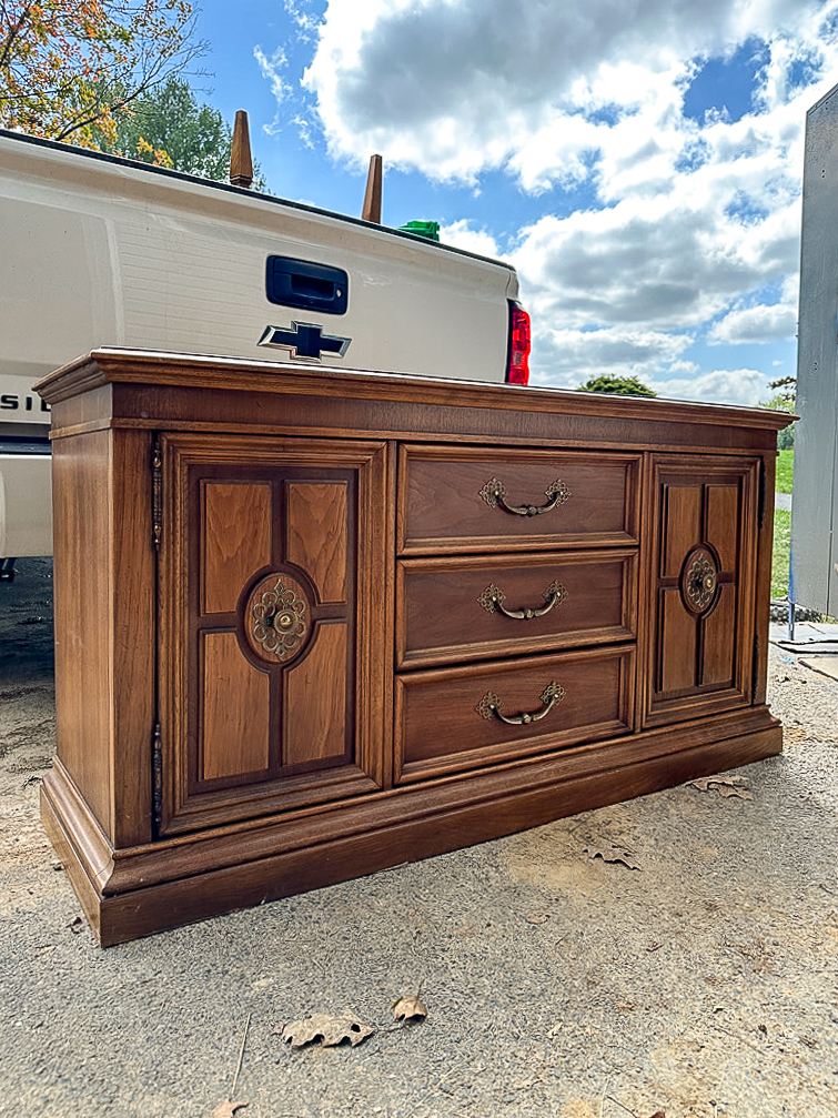 dated wood credenza before