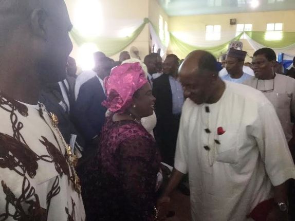 Photo of Pateince Jonathan and Rotimi Amaechi smiling at each other 