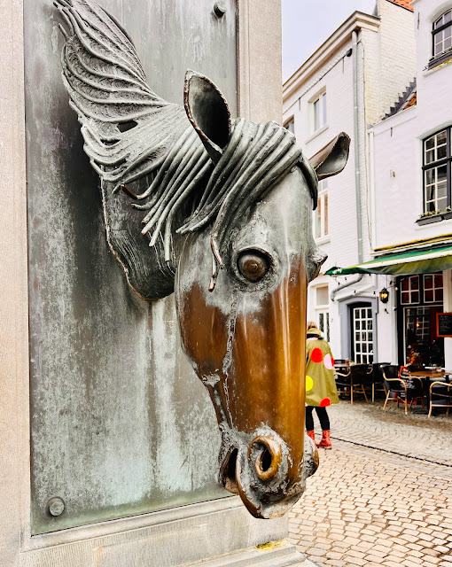 horse head on water fountain, Bruges, Belgium