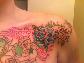 Tattooed Women - Chest shoulder Flower Tattoo Designs