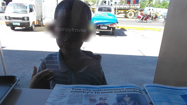 beggar kid outside of Jollibee Consolacion Cebu