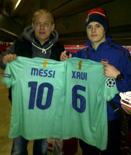 Jack Wilshere posted a picture of him and his dad proudly holding Lionel Messi and Xavi's shirts on his Twitter page