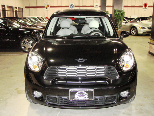 It's Absolute Black 2011 MINI Cooper S Countryman All4 with only 25 miles