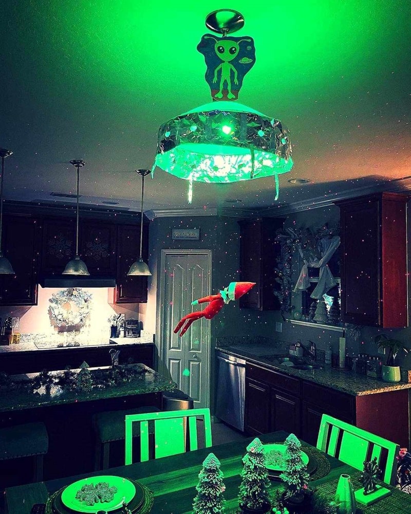 elf being abducted by aliens.