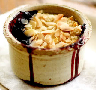 Summer fruit crumble in an earthenware dish.