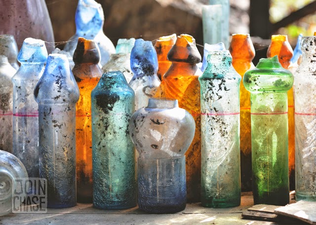 Colorful, broken glass bottles at Nagar Glass Factory in Yangon, Myanmar.