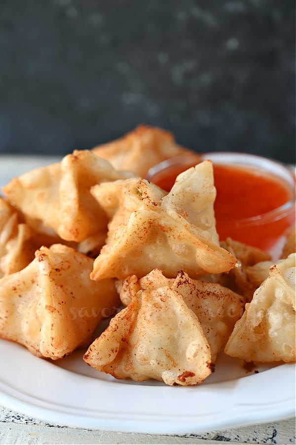 easy fried cran rangoon with sweet chili sauce on a white plate