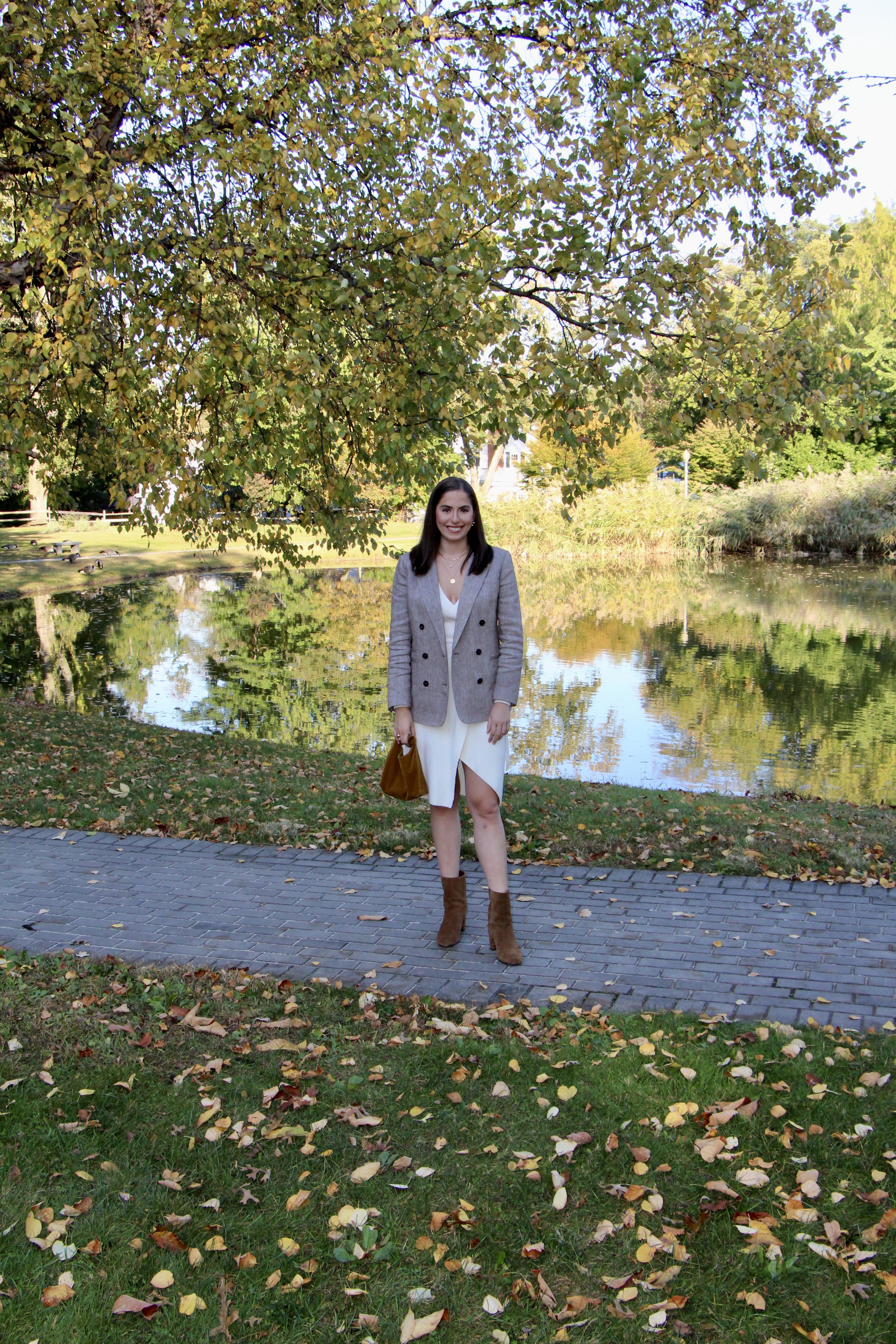 tweed blazer, leaves, white sweater dress, thanksgiving outfit idea, ankle boots, suede boots, tweed blazer, oversized blazer, double breasted blazer, wrap dress, fall outfit