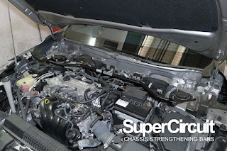 Toyota corolla cross non-hybrid engine bay with supercircuit front strut bar installed