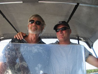 Eric at the helm of his skiff with Capt. John